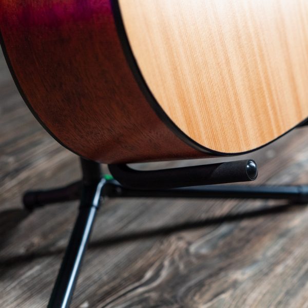 closeup of acoustic guitar on Stageline stand